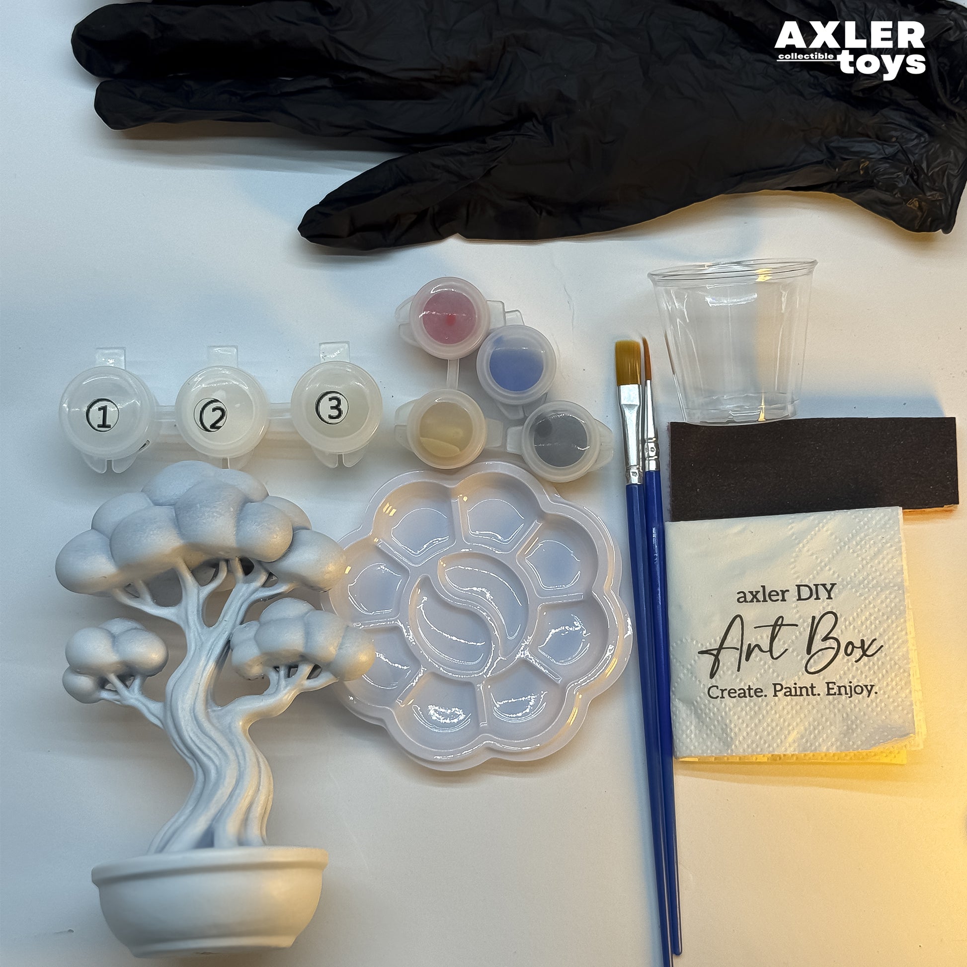 Paint your own figure kit contents — paints, brushes, palette